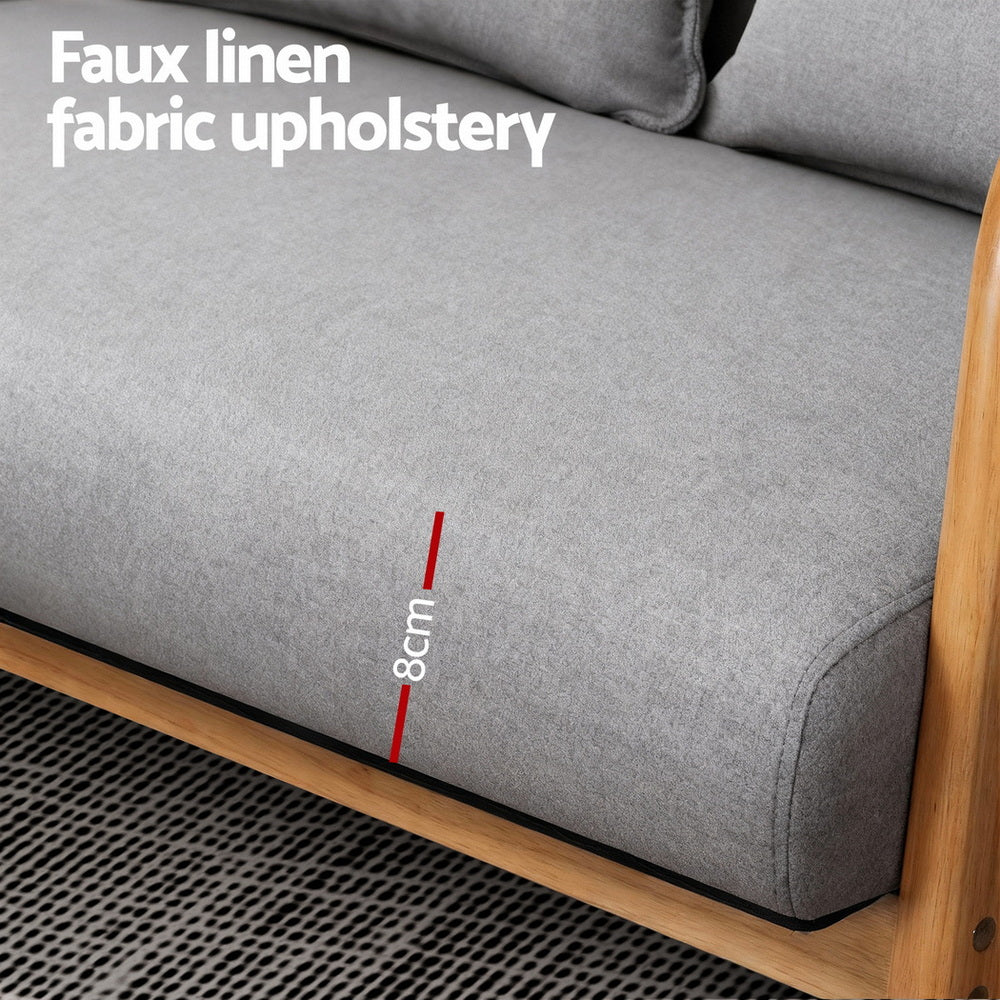 Close-up of grey faux linen sofa seat labelled "Faux linen fabric upholstery" showing 8cm cushion thickness