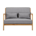 Grey fabric 2-seater sofa with natural wood open-arm frame and two lumbar cushions, front view on white background