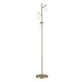 Gold 3-globe floor lamp with three white frosted glass globe shades on brass arms and round base on white background