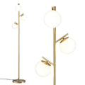 Gold 3-globe floor lamp with three frosted glass globe shades on brass pole and round base, globe fitting detail on right