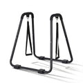 Black dip station parallel bars on white background with non-slip grip handles and dual hanging rings
