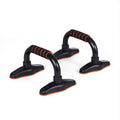 Pair of black push-up stands with orange-striped foam grips and non-slip orange base pads on white background