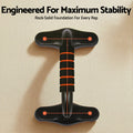Top-down view of single black push-up stand with orange stability marker points on beige surface