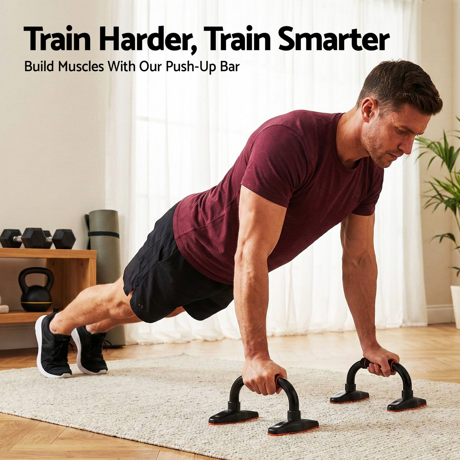 Man in red t-shirt doing push-ups on black push-up stands on rug in home gym with dumbbells and kettlebell