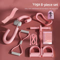 pink 8-piece yoga fitness kit flat lay on rose background with workout planner card and carry bag
