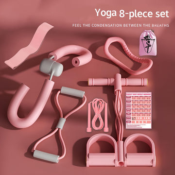 pink 8-piece yoga fitness kit flat lay on rose background with workout planner card and carry bag