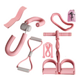 pink yoga 8-piece fitness kit on white background showing ab roller resistance tubes and carry bag