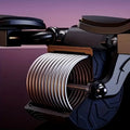 Close-up of grooved ab wheel showing textured ridges and metal axle on gradient background