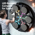 Child in boxing gloves punching circular wall-mounted boxing machine with LED lights, text reads LED Runway Compete for Speed