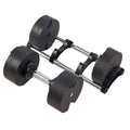 Single Powertrain EON dumbbell with dial selector shown above range of weight plates up to 45kg