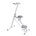 White foldable stair stepper on white background showing triangular steel frame, grey textured pedals and resistance cable