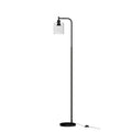 Black arc floor lamp with slim curved arm and clear cylindrical glass shade on round base, white background