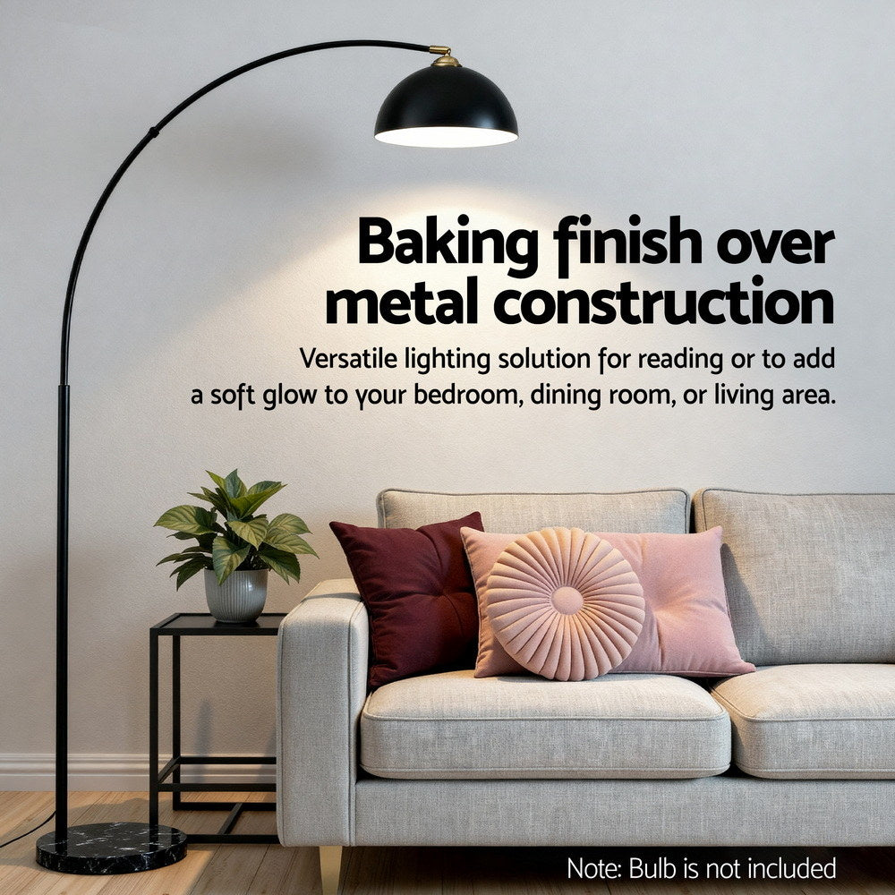 Feature banner Baking finish over metal construction with arc lamp and black dome shade over a grey sofa with cushions