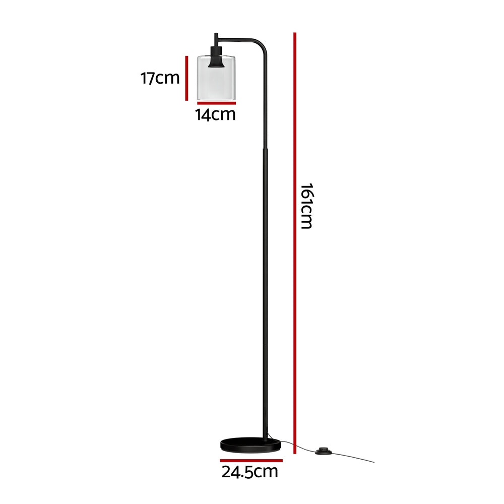 Black arc floor lamp with slim curved arm and clear cylindrical glass shade on round base, white background