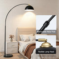 Arc floor lamp in bedroom with callouts: Retractable Metal Pole close-up and Flexible Lamp Head brass swivel fitting
