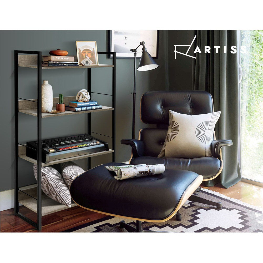 Artiss industrial 4-tier bookshelf styled with books and music gear beside black leather lounge chair in dark living room