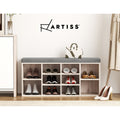 Artiss oak shoe bench grey cushion loaded with shoes in lifestyle setting with Artiss logo on wall and white handbag on top