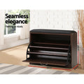 Artiss walnut shoe bench with flip-down door open showing empty adjustable shelves 63cm wide 30cm deep in lifestyle setting