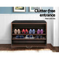 Artiss walnut shoe bench with flip-down door open showing heels and flats on shelves in entrance hallway setting
