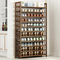 Bamboo 10-tier shoe rack fully loaded with shoes in living room, placed next to drinks cabinet