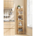 Bamboo 6-tier slim shelf in kitchen corner styled with wine bottles, plates, jars and pantry items beside window with blinds