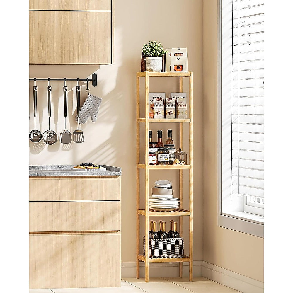 Bamboo 6-tier slim shelf in kitchen corner styled with wine bottles, plates, jars and pantry items beside window with blinds