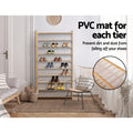 Bamboo 9-tier shoe rack in bedroom lifestyle with shoes on shelves and PVC mat inset showing dirt prevention feature