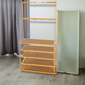 Bamboo hall stand with coat hooks and shoe shelves alongside a standing mirror in curtained hallway