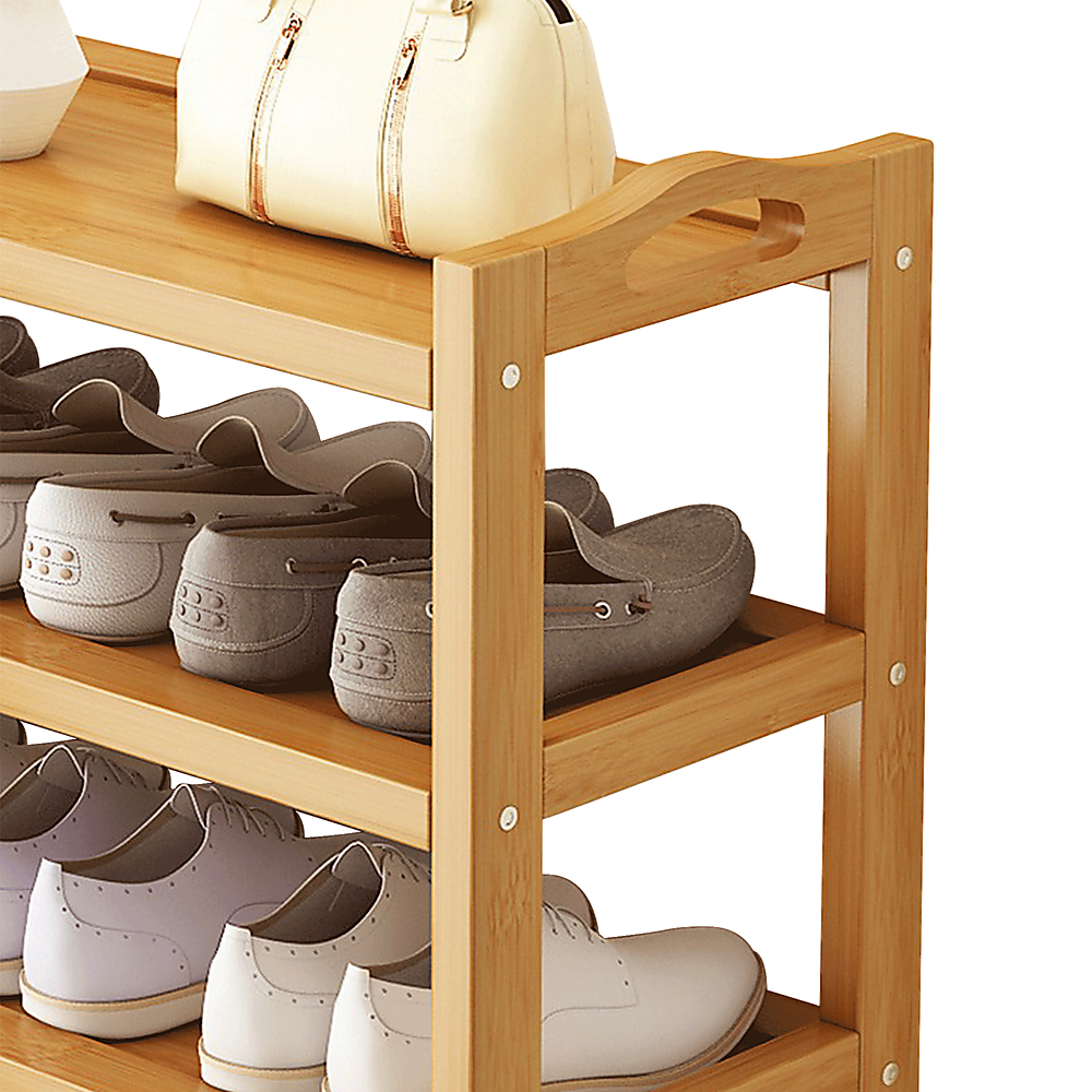 Natural bamboo shoe rack with side handle cutouts loaded with heels and flats, handbag on top shelf