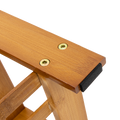 Close-up of bamboo shoe bench leg base showing screws and black rubber anti-slip foot pad detail
