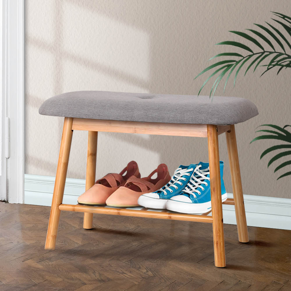 Bamboo shoe bench with grey tufted cushion and slatted shelf in hallway, wider angle view