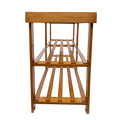 Side profile view of natural bamboo shoe bench showing two-tier slatted storage structure