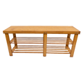 Natural bamboo shoe bench with flat solid seat and two slatted lower shelves, front view white background