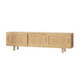 Natural bamboo TV unit angle view on white three sliding slatted doors with recessed handles on angled bamboo legs