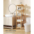 Bamboo slim shelf in bathroom between vanity and toilet, styled with skincare, towels and baskets; text reads Slim Silhouette