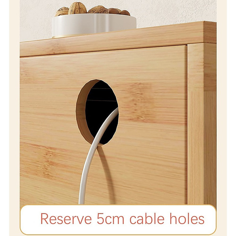 Natural bamboo TV unit close-up of 5cm cable hole with white cable routed through and walnut bowl on top