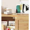 Natural bamboo TV unit thickened plate top shelf detail with art prints tissue box and food items in open bay