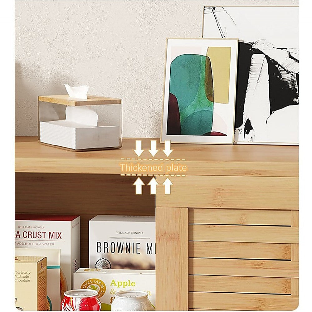 Natural bamboo TV unit thickened plate top shelf detail with art prints tissue box and food items in open bay