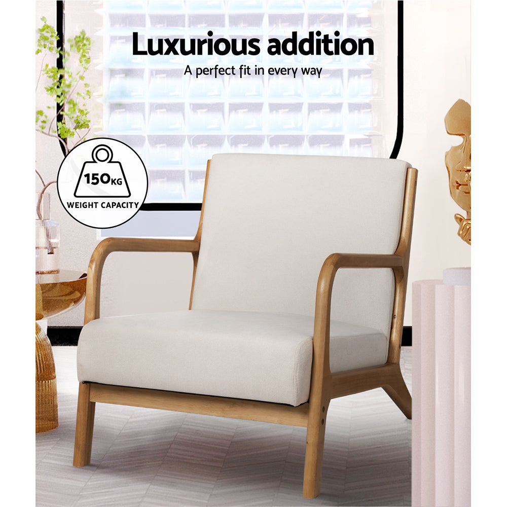 Beige fabric armchair with wood frame in living room lifestyle shot showing 150kg weight capacity badge