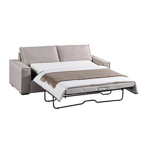 Beige fabric sofa bed fully extended showing white mattress with brown throw blanket and black metal frame