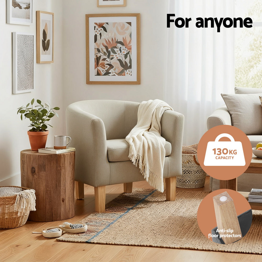 Beige fabric tub armchair in living room with throw blanket showing 130kg capacity and anti-slip floor protectors badges