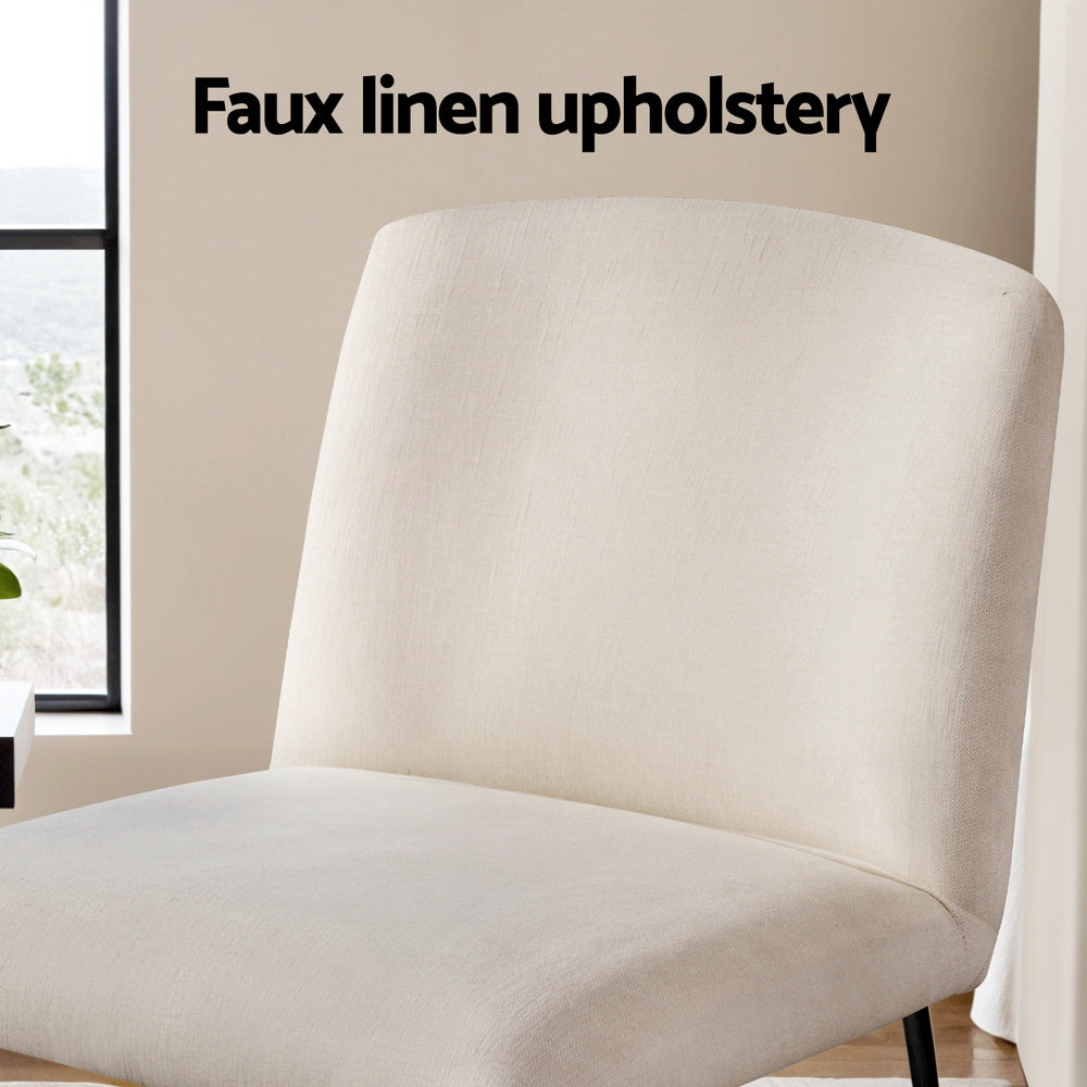 Close-up of beige faux linen accent chair back and seat in room with window, "Faux linen upholstery" text overlay