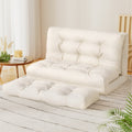 Cream beige PU leather 2-seat floor lounger upright in minimal white room with round table, wood chair and sheer curtains