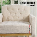 Close-up of cream teddy armchair showing 16cm thick padded seat with Thick padded seat text and tufted backrest