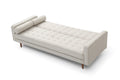 Beige velvet sofa bed in flat position seen from top-down angle showing tufted surface fully extended