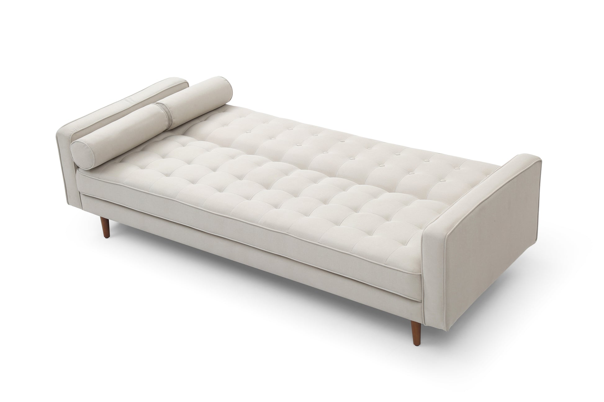 Beige velvet sofa bed in flat position seen from top-down angle showing tufted surface fully extended