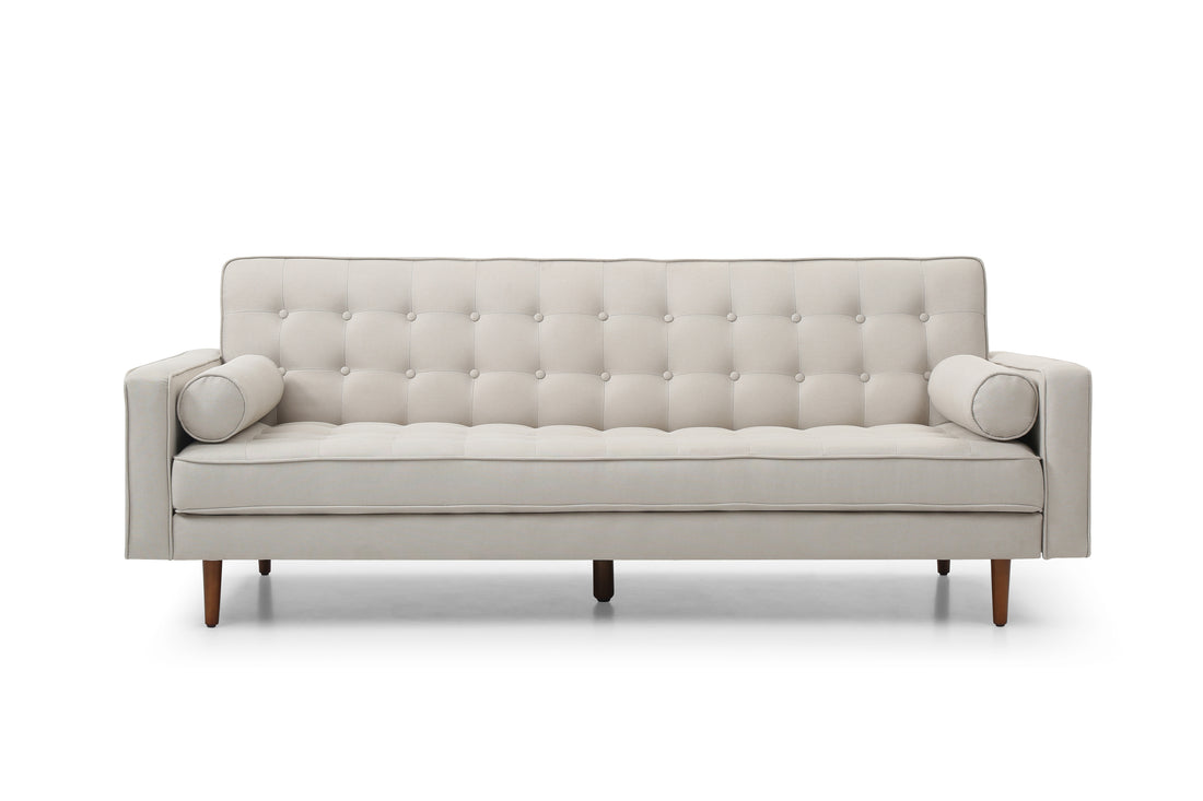 Beige velvet tufted sofa bed in lifestyle room scene in upright sofa position with scatter cushions