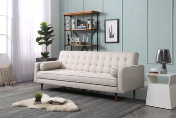 Beige velvet tufted sofa bed in lifestyle room scene in upright sofa position with scatter cushions