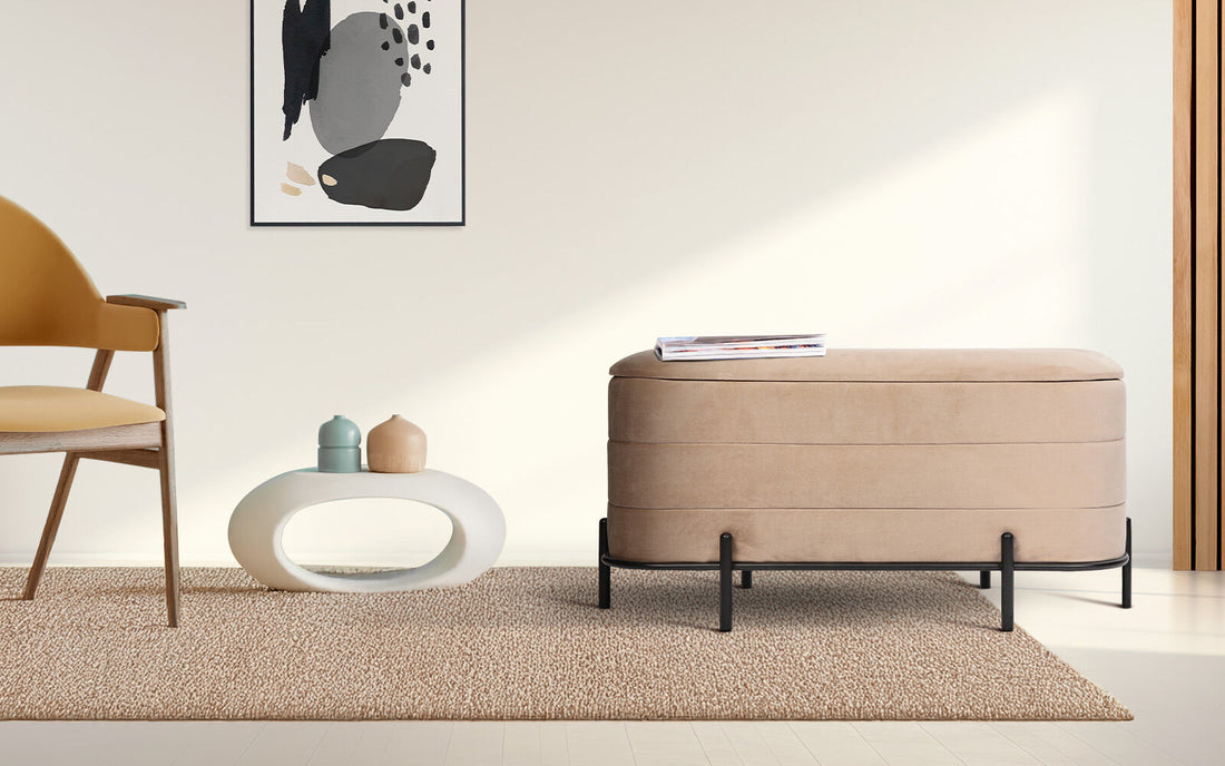 Oval linen fabric storage ottoman with channel stitching, natural wood grain lid and black metal frame base on white