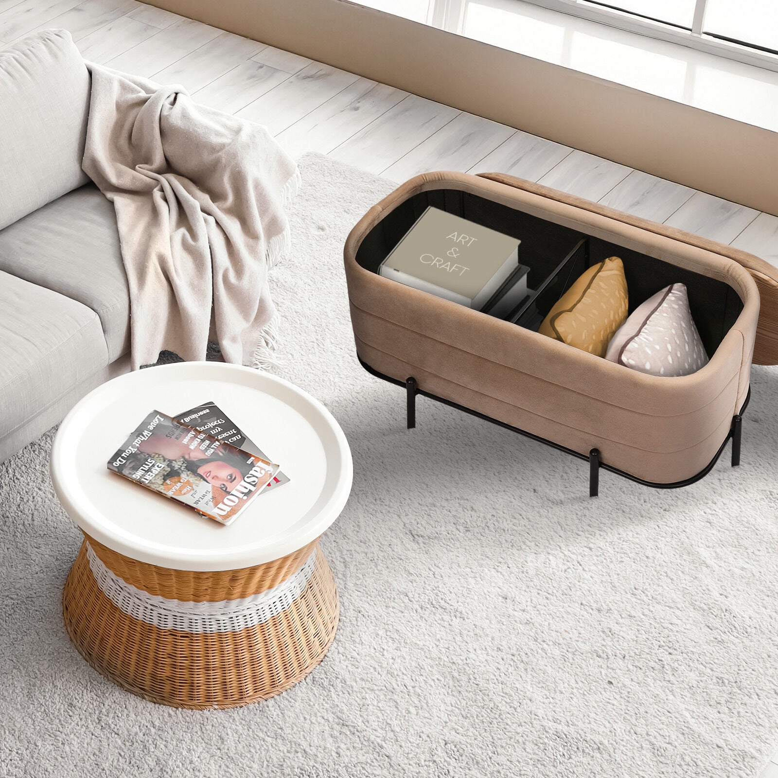 Beige velvet storage bench with black metal base shown open revealing interior compartments with cushions and a book in a